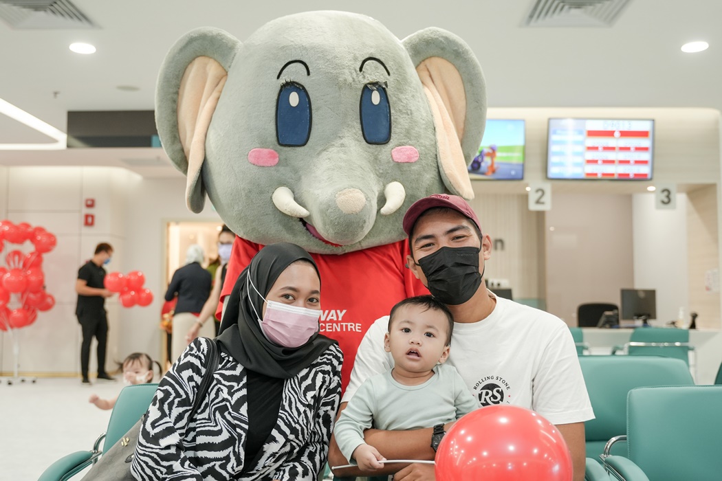 Elfy Mascot with parents and child at Paeds Clinic