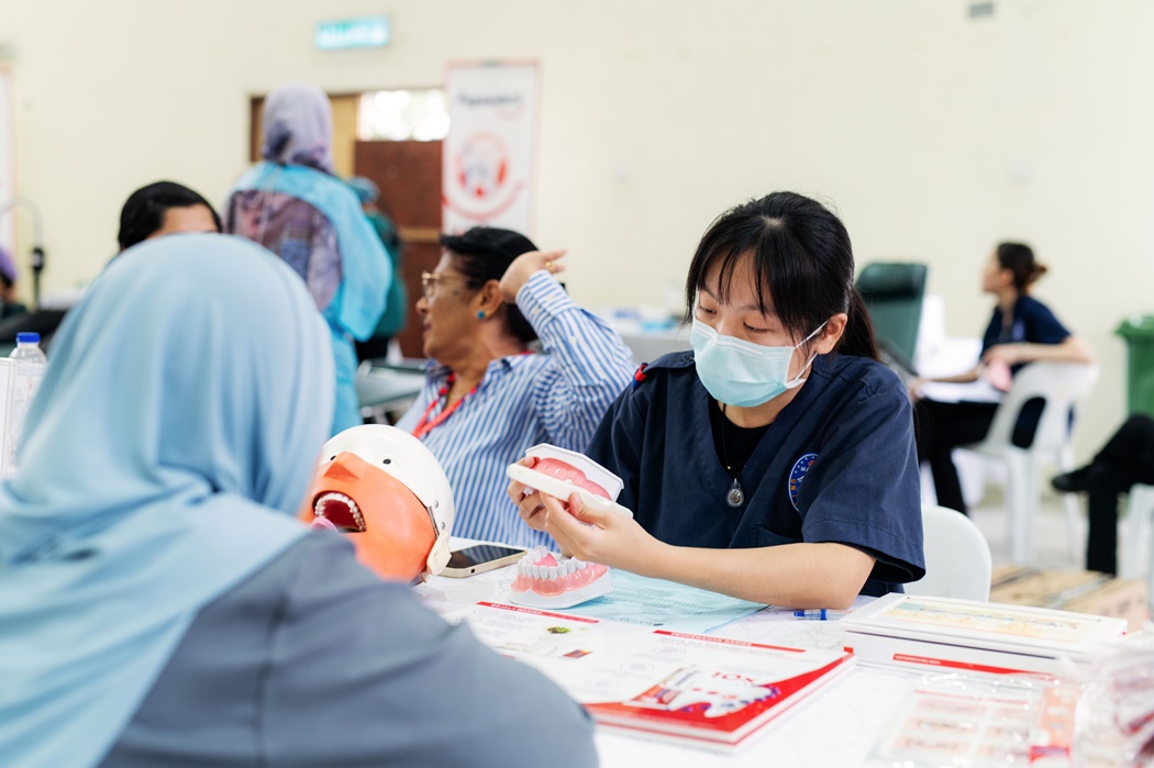 Resident receiving their dental consultation at the table clinic session from MAHSA University