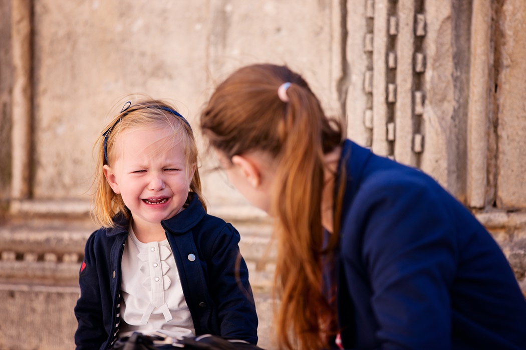 portrait of cute little girl crying