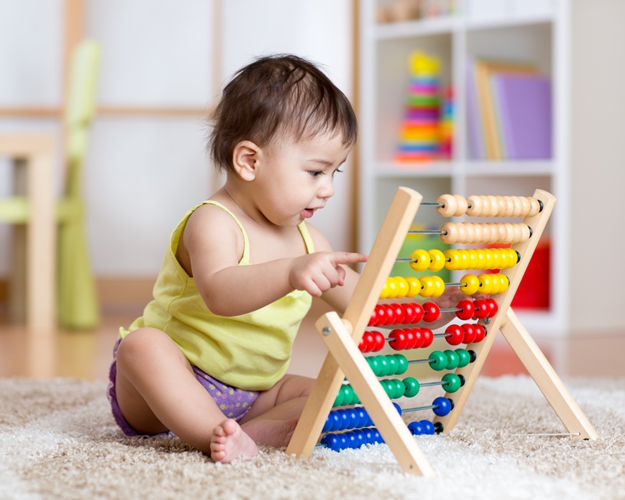Baby playing with counter toy
