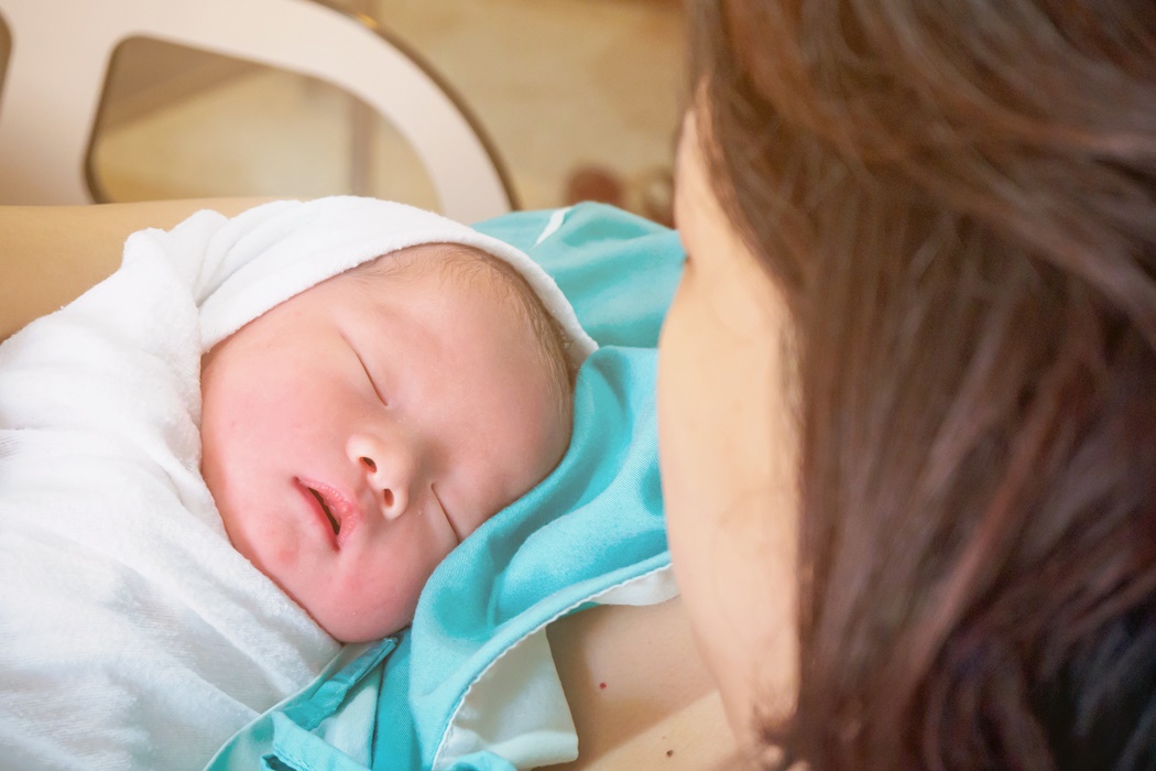 Happy Mother and Newborn Baby at the hospital