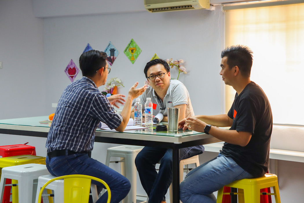 three dads talking to each other about parenting