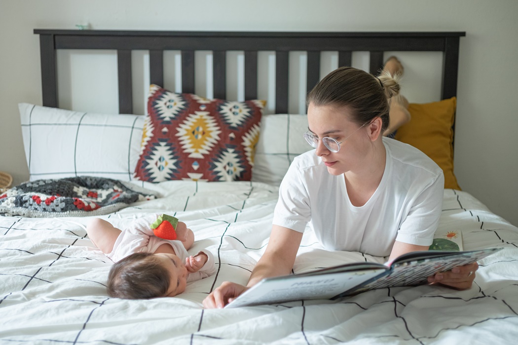 Young mother working on laptop 