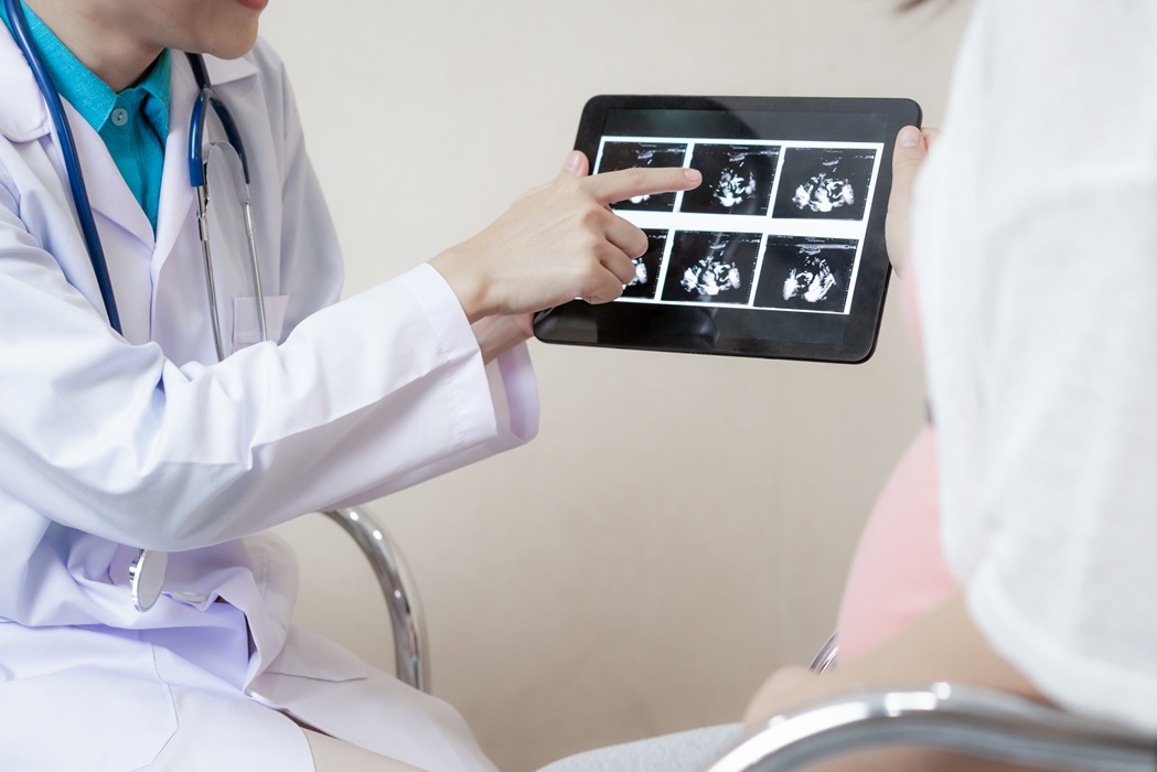 Pregnant Woman and Gynecologist Doctor at Hospital