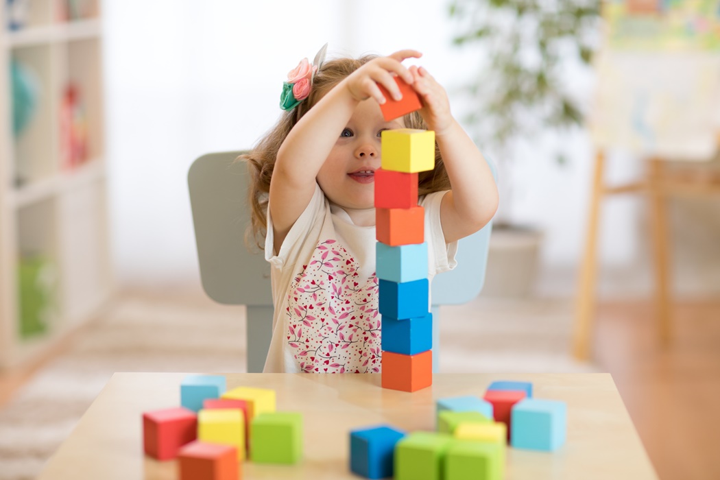 kid playing blocks