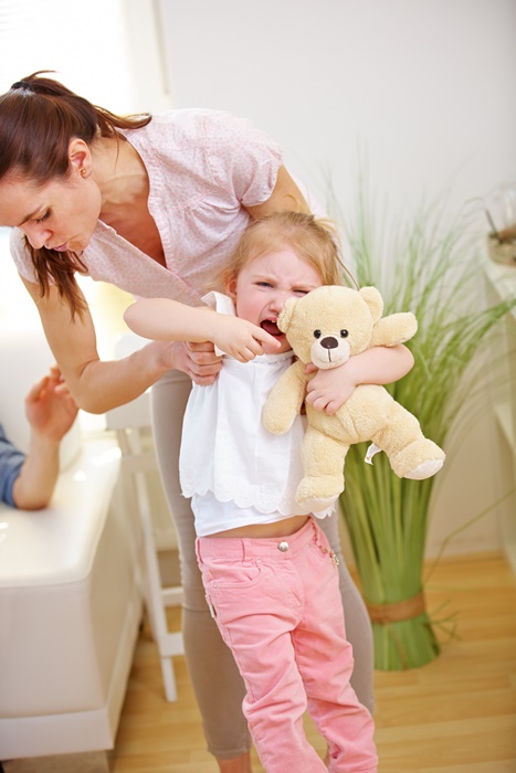 Mother with crying child at home