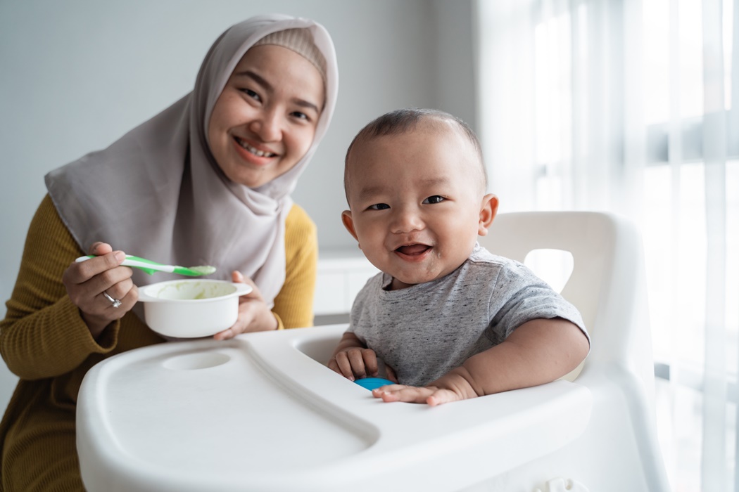 asian baby boy smiling to camera