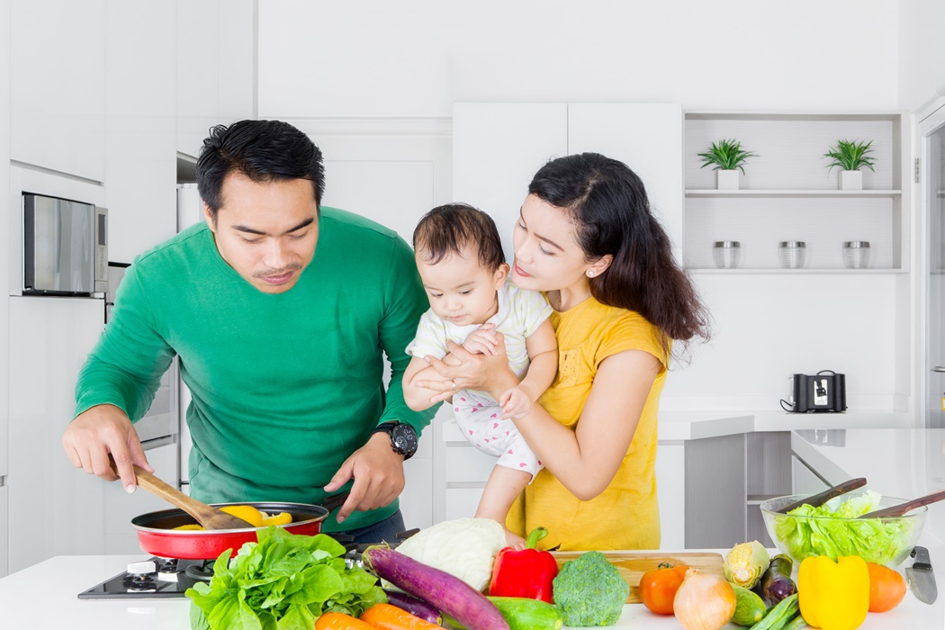 Asian family cooking vegetable