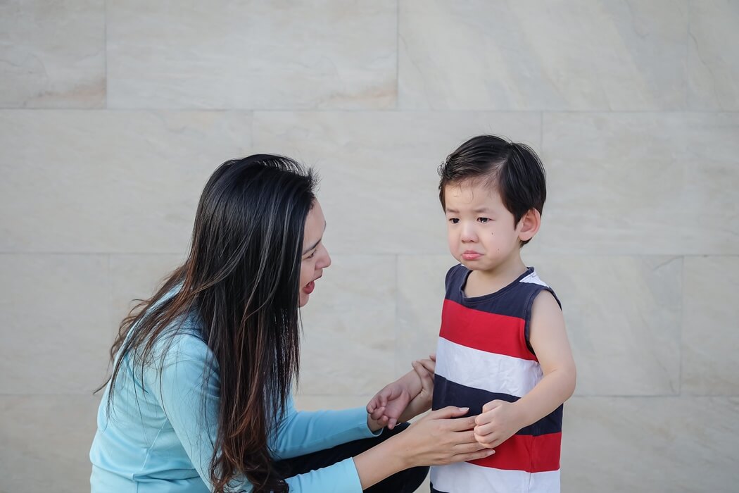 mum comforting her son