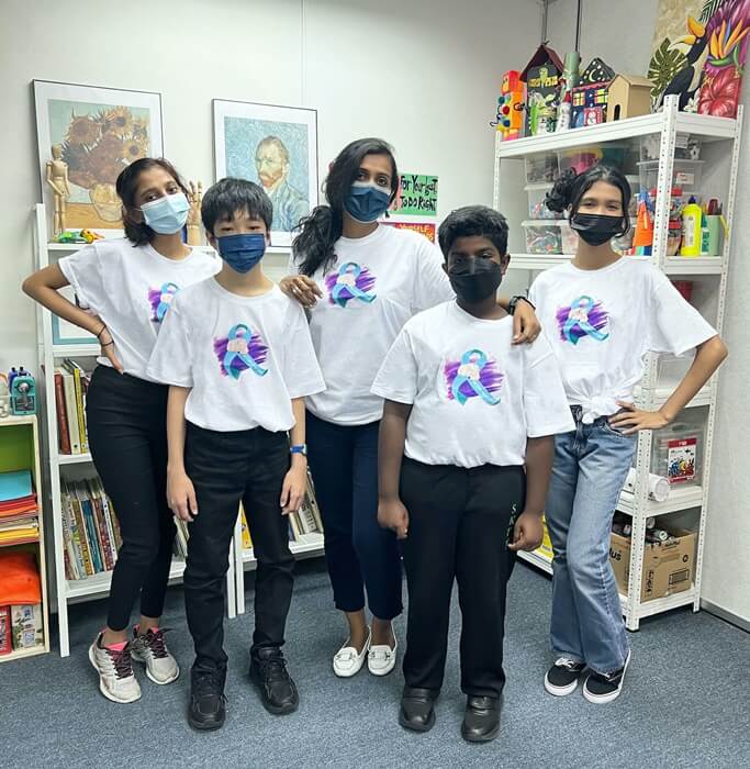 The Children’s Art Studio with children from the studio who were part of the project to design exclusive t-shirts