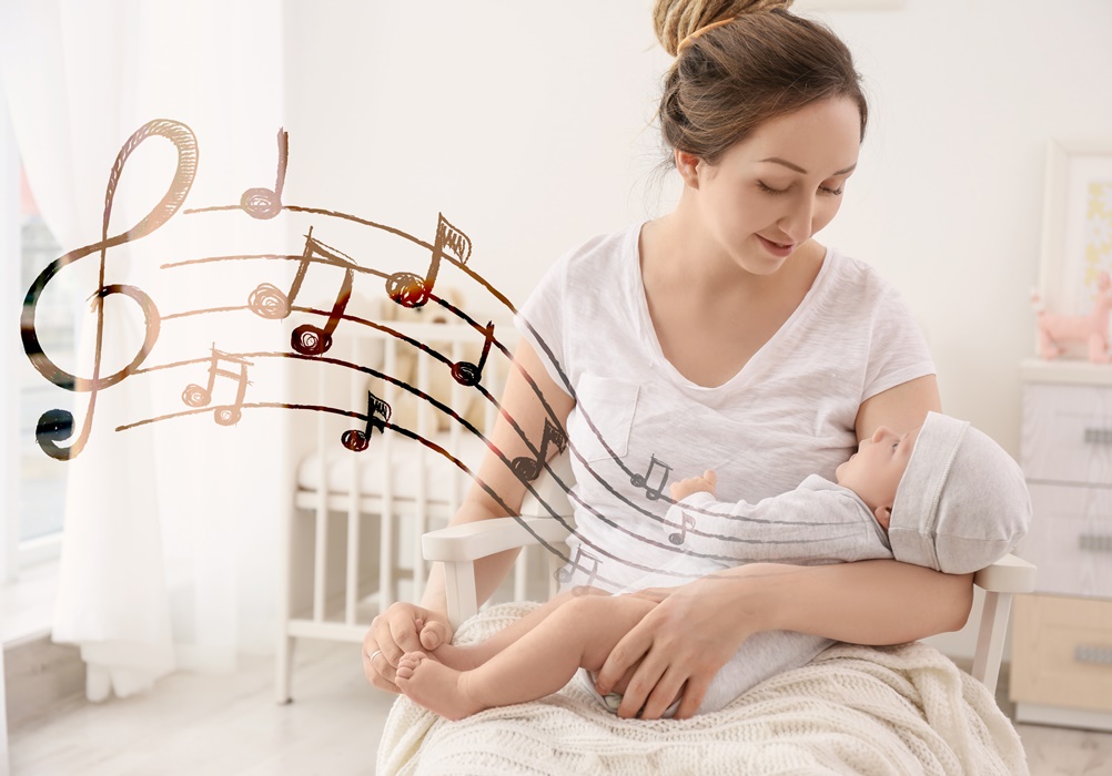 Mother with baby at home. Lullaby songs and music concept