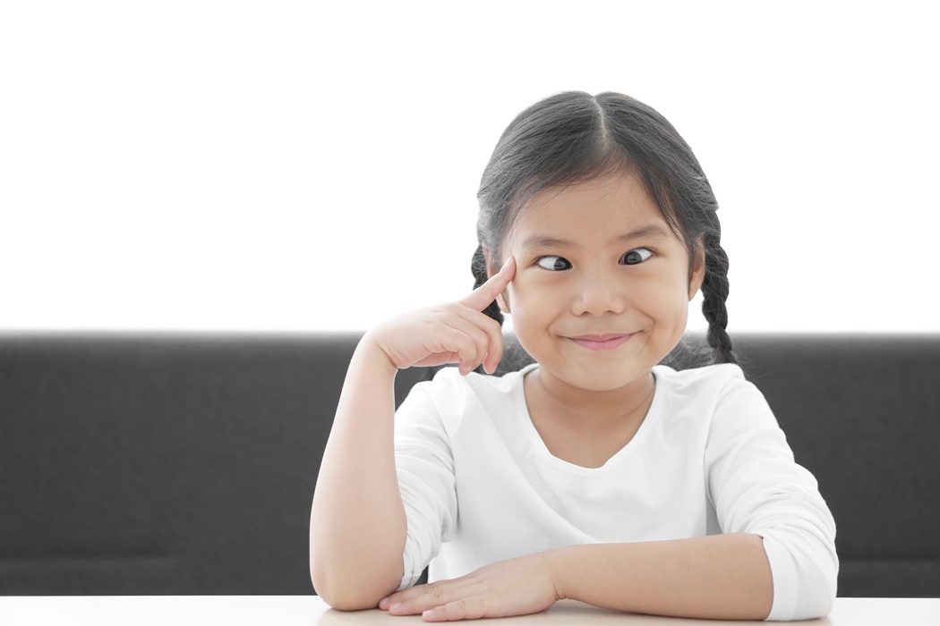 Asian child strabismus or kid girl squint lazy eye and amblyopia