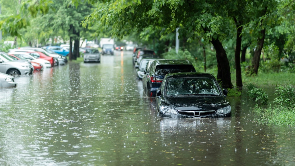 Flooded cars on the street of the city. Street after heavy rain. Water could enter the engine, transmission parts or other places. Disaster Motor Vehicle Insurance Claim Themed. Severe weather concept