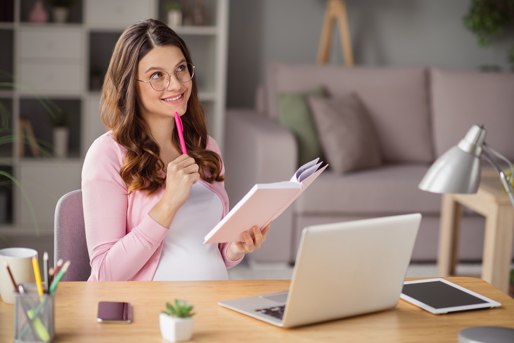 Portrait of attractive creative curious cheerful pregnant girl staying home planning week month self isolation house indoors