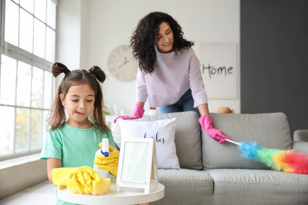 Mother and daughter cleaning their flat
