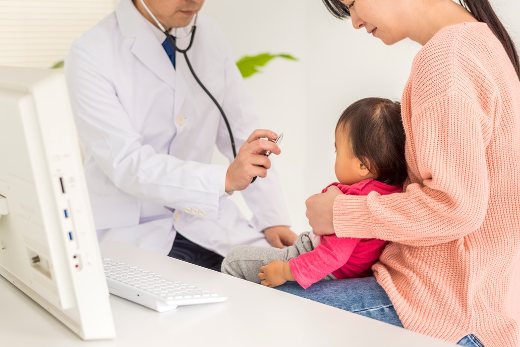 Pediatricians examining children